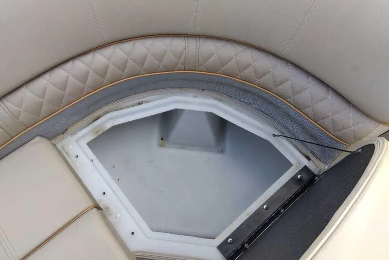Slide: The Image of 2024 Ranger Reata 220C boat seat storage compartment with quilted upholstery. - 58