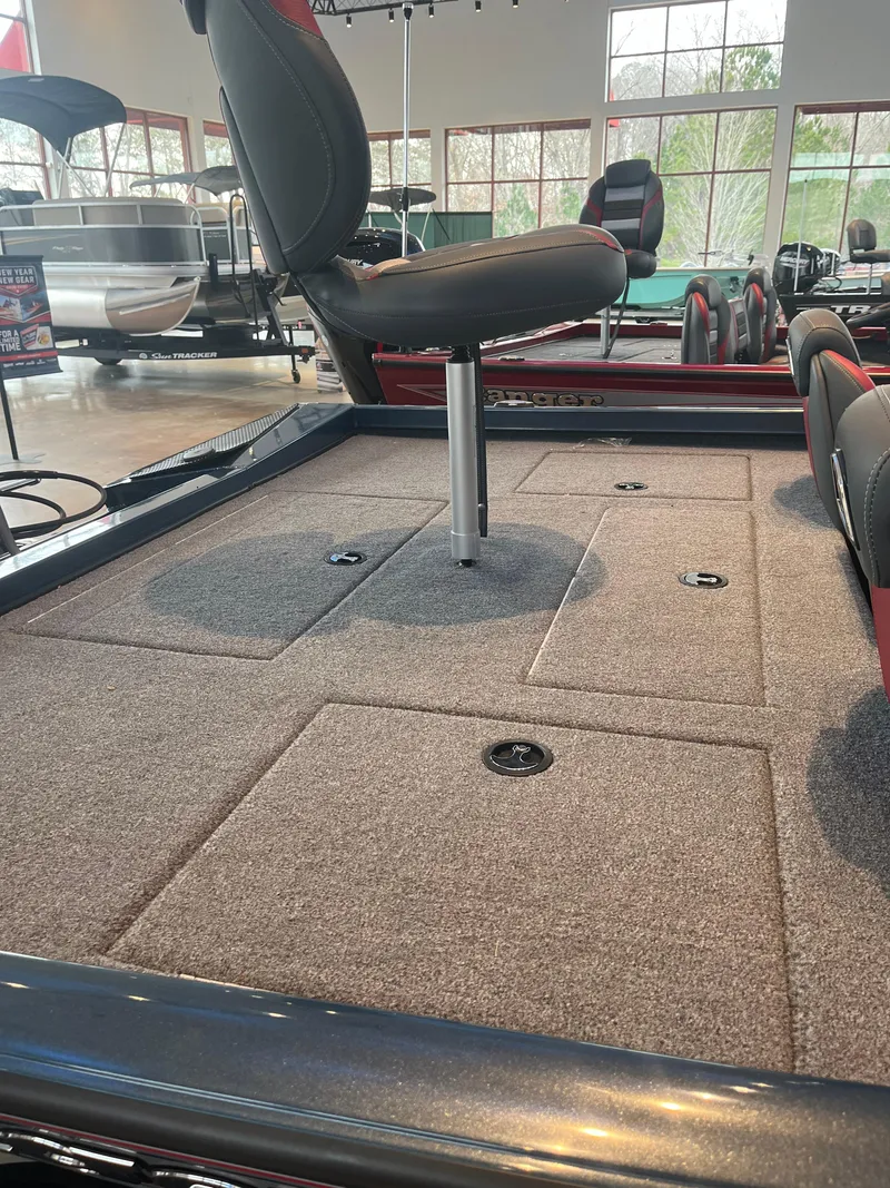 Slide: The Image of 2024 Ranger RT198P boat interior with modern dashboard and seating. - 6