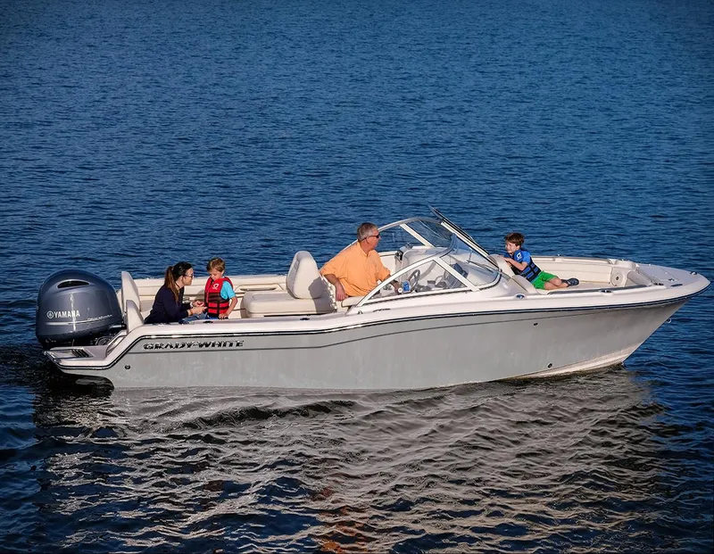 The Image of 2024 Grady-White 215 boat cruising with family on a calm lake. - 1