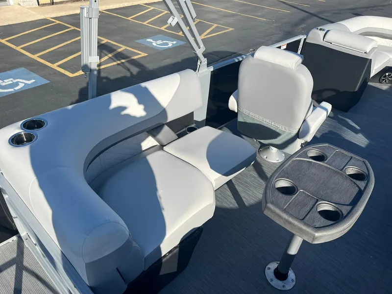 Slide: The Image of 2024 Lowe SS 210 WT boat interior with seating and cup holders. - 13
