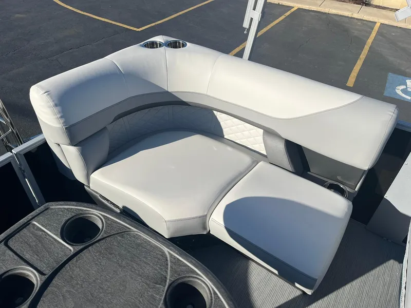 Slide: The Image of 2024 Lowe SS 210 WT boat with luxurious seating and cup holders. - 15