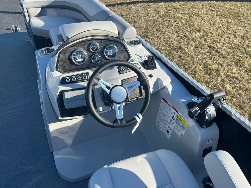 Slide: The Image of 2024 Lowe SS 210 WT boat dashboard and steering wheel. - 7