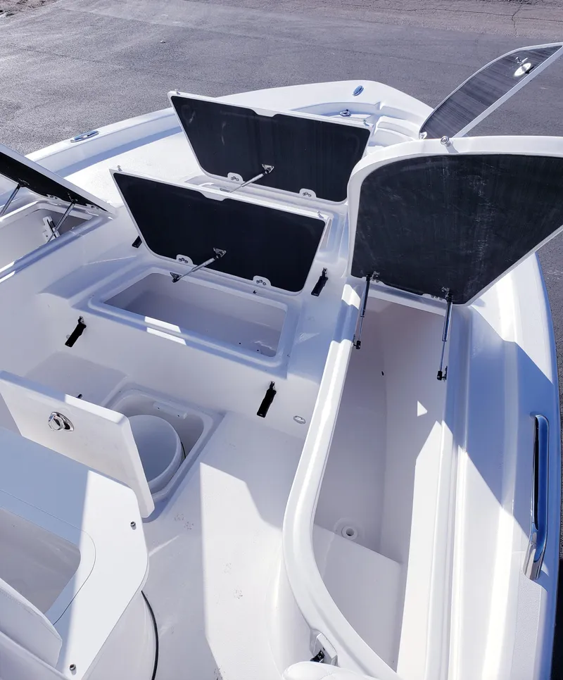 Slide: The Image of 2024 Sea Fox 231 Bay Fox boat with open storage compartments. - 15