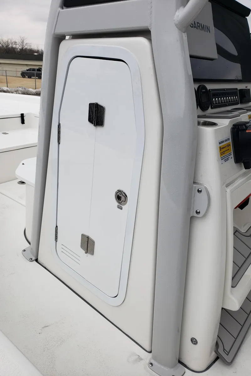 Slide: The Image of 2024 Sea Fox 231 Bay Fox center console storage compartment. - 17