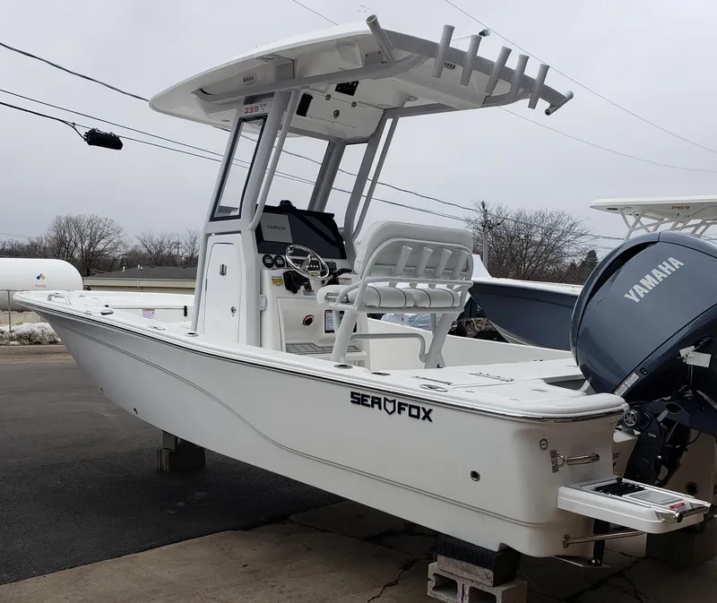 Slide: The Image of 2024 Sea Fox 231 Bay Fox boat with Yamaha engine, docked on a trailer. - 5