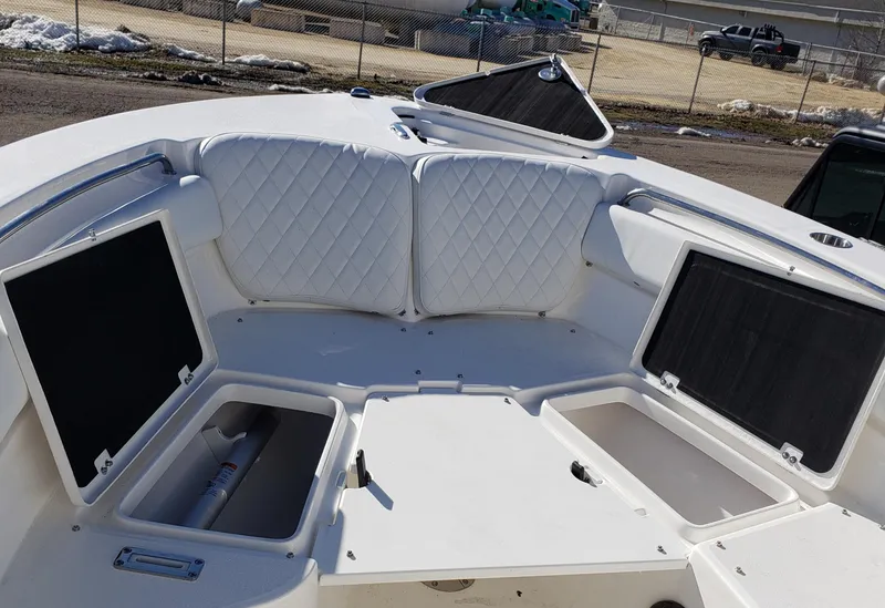 Slide: The Image of 2024 Sea Fox 248 Side Console boat with open storage compartments. - 12