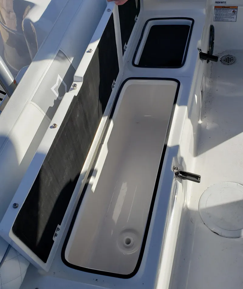 Slide: The Image of 2024 Sea Fox 248 Side Console storage compartments. - 14