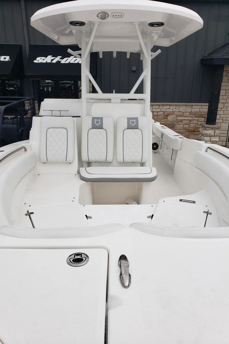 Slide: The Image of 2024 Sea Fox 248 Side Console boat interior with seating and storage compartments. - 19