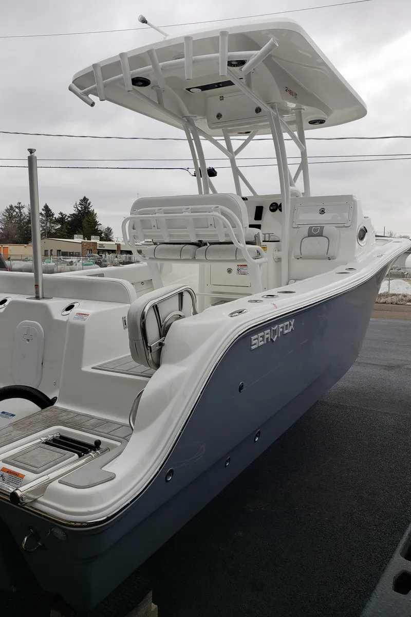 Slide: The Image of 2024 Sea Fox 248 Side Console boat with T-top and dual console layout. - 21