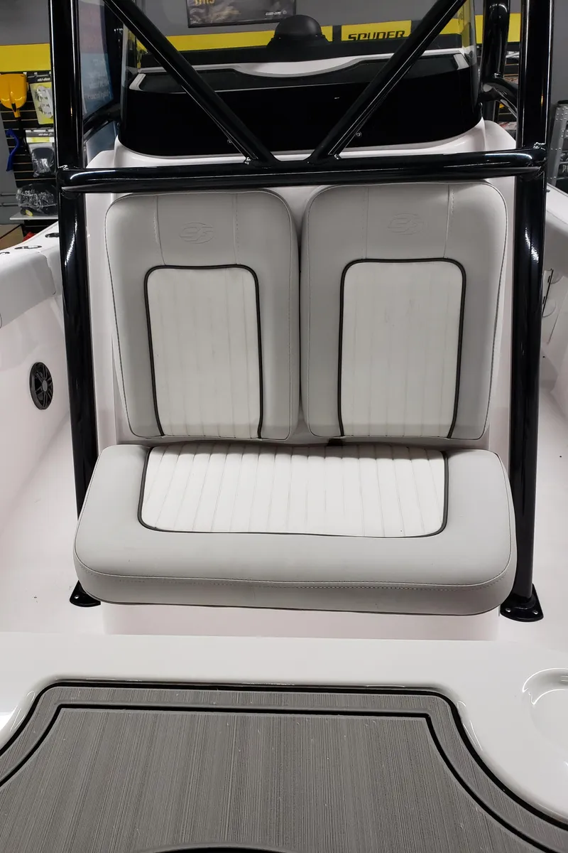 Slide: The Image of 2023 Sea Fox 228 Commander boat seating area with white cushioned seats. - 9