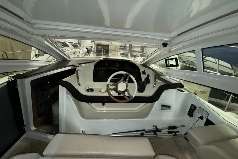 Slide: The Image of Interior helm of 2018 Beneteau 40 Gran Tourismo yacht, featuring modern controls and steering. - 13