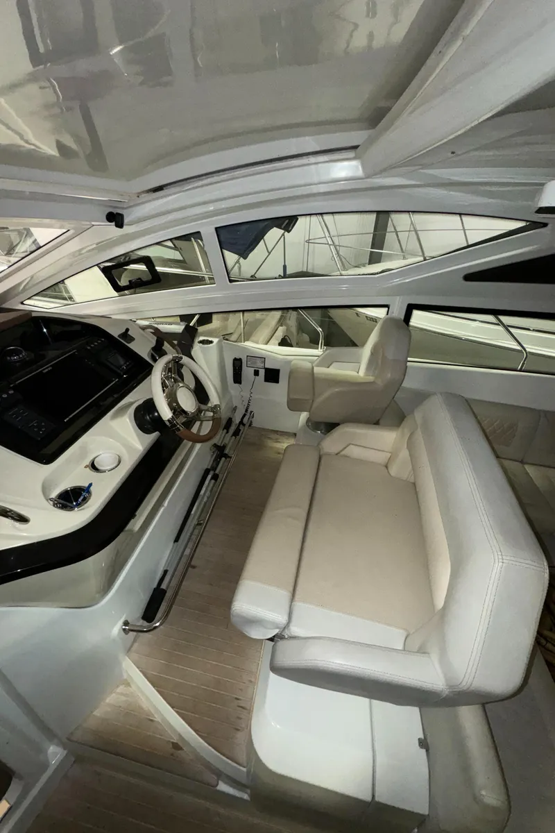 Slide: The Image of Interior of 2018 Beneteau 40 Gran Tourismo yacht with modern helm and seating. - 14