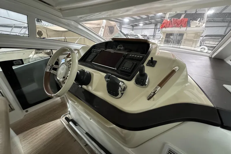 Slide: The Image of 2018 Beneteau 40 Gran Tourismo helm with modern controls and steering wheel. - 15