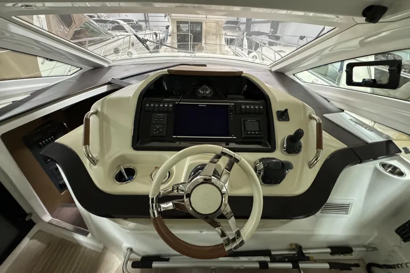 Slide: The Image of Cockpit of 2018 Beneteau 40 Gran Tourismo yacht with modern steering and controls. - 16