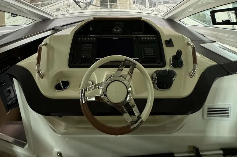 Slide: The Image of 2018 Beneteau 40 Gran Tourismo helm with modern controls and steering wheel. - 17