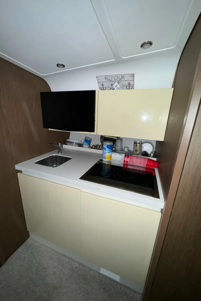 Slide: The Image of Compact kitchen area in a 2018 Beneteau 40 Gran Tourismo yacht. - 22