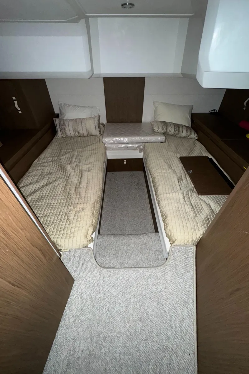 Slide: The Image of 2018 Beneteau 40 Gran Tourismo cabin with twin beds and modern interior design. - 24