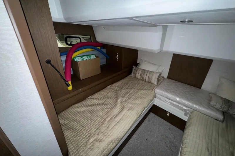 Slide: The Image of Interior cabin of 2018 Beneteau 40 Gran Tourismo with twin beds and storage. - 25