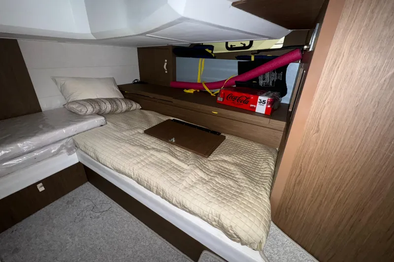 Slide: The Image of 2018 Beneteau 40 Gran Tourismo cabin with cozy bedding and storage space. - 26
