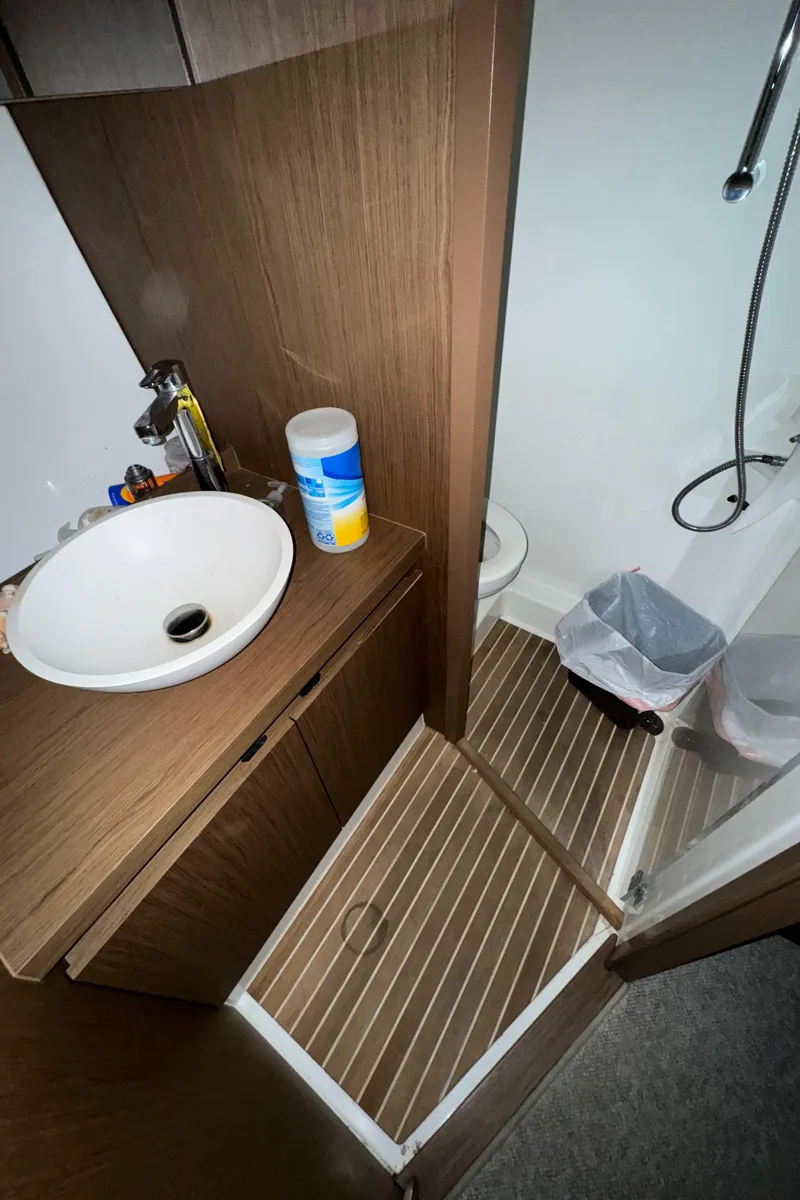 Slide: The Image of 2018 Beneteau 40 Gran Tourismo bathroom with sink, shower, and wooden flooring. - 27