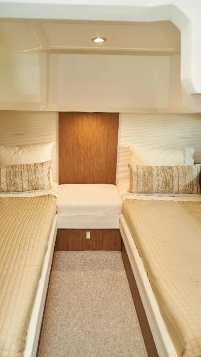 Slide: The Image of 2018 Beneteau 40 Gran Tourismo cabin with twin beds and modern decor. - 3