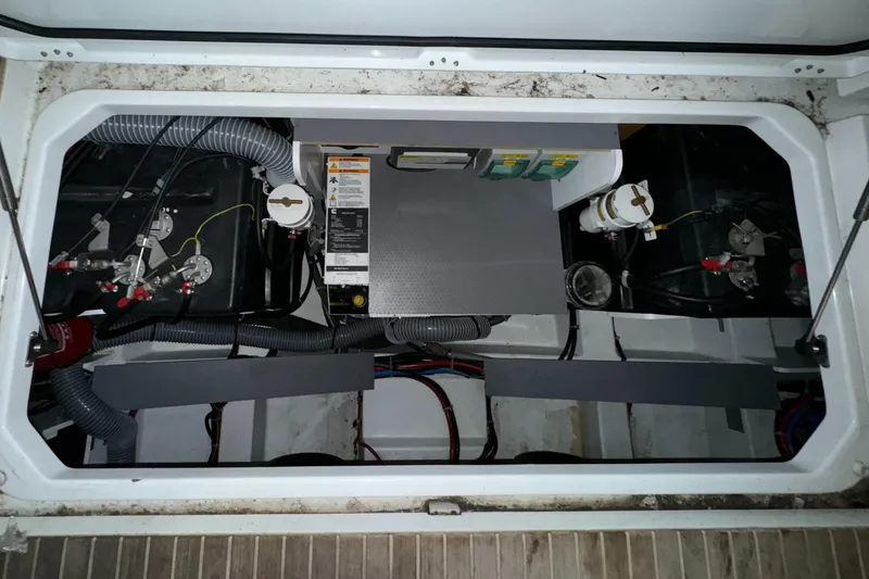 Slide: The Image of Engine compartment of 2018 Beneteau 40 Gran Tourismo with visible wiring and components. - 30