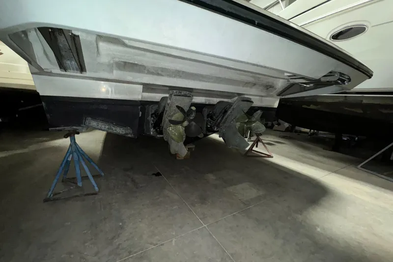 Slide: The Image of 2018 Beneteau 40 Gran Tourismo boat underside on stands in storage. - 4