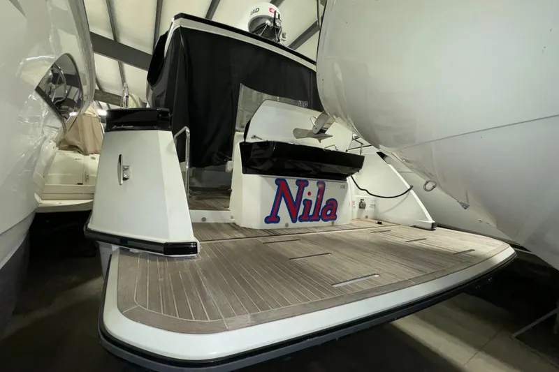 Slide: The Image of 2018 Beneteau 40 Gran Tourismo yacht in storage, rear view with "Nila" nameplate. - 6