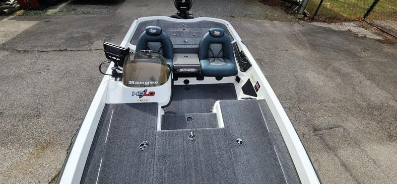 Slide: The Image of 2005 Ranger 520 VX fishing boat with dual seats and carpeted deck. - 10