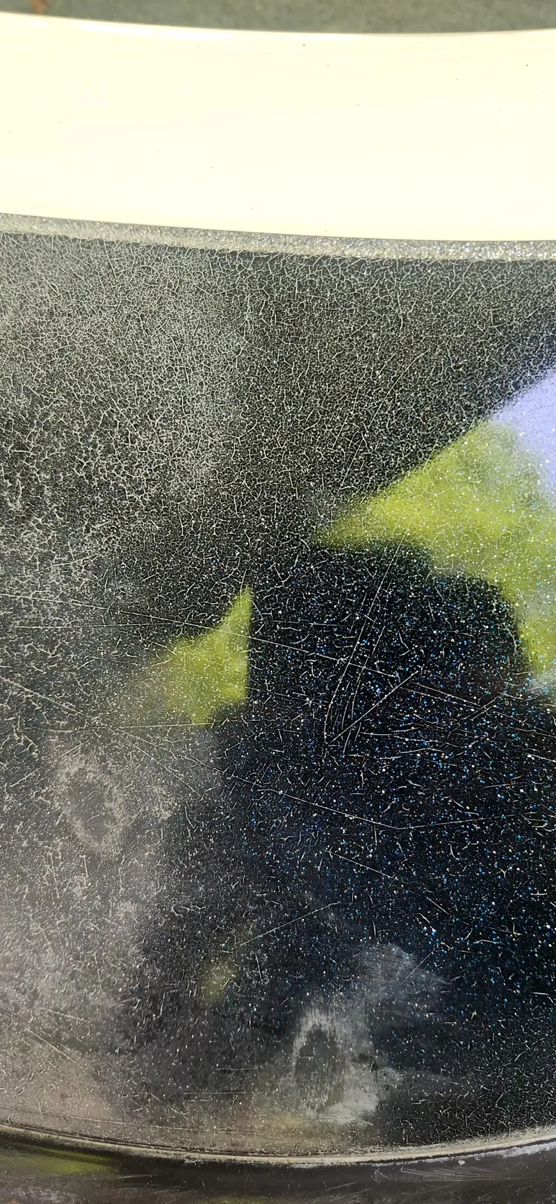 Slide: The Image of Close-up of a 2005 Ranger 520 VX surface with visible wear and reflections. - 18