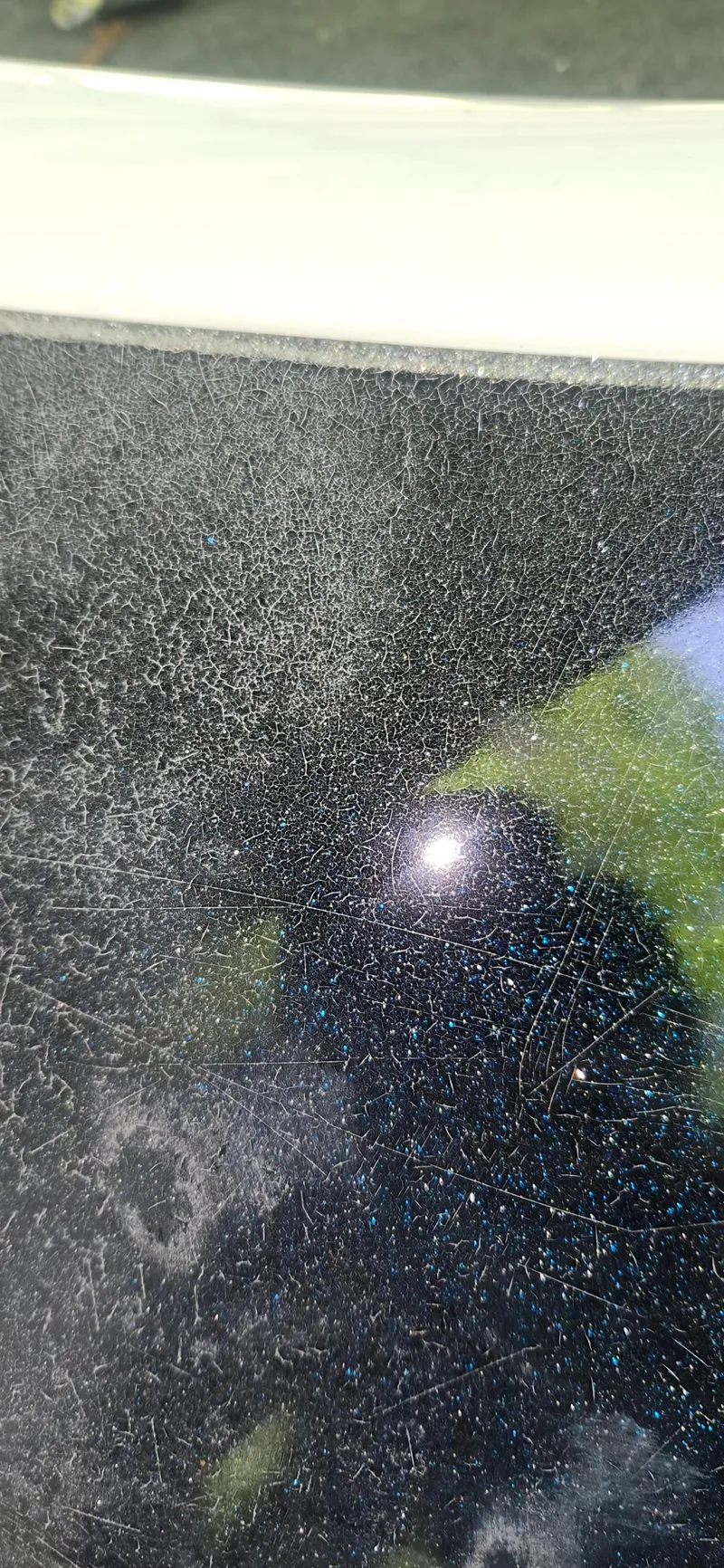 Slide: The Image of Close-up of a scratched surface on a 2005 Ranger 520 VX boat. - 19