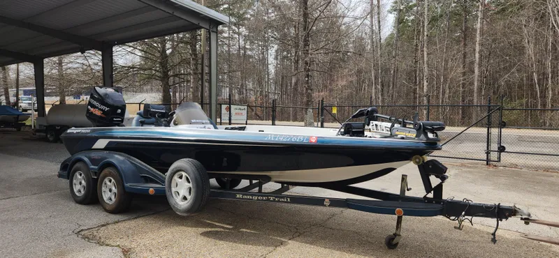 Slide: The Image of 2005 Ranger 520 VX boat on trailer in outdoor storage. - 2