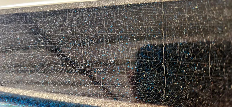 Slide: The Image of Close-up of 2005 Ranger 520 VX boat surface with visible cracks and sparkles. - 20