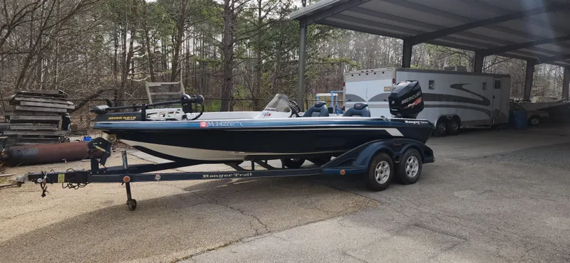 Slide: The Image of 2005 Ranger 520 VX boat on trailer in covered storage area. - 6