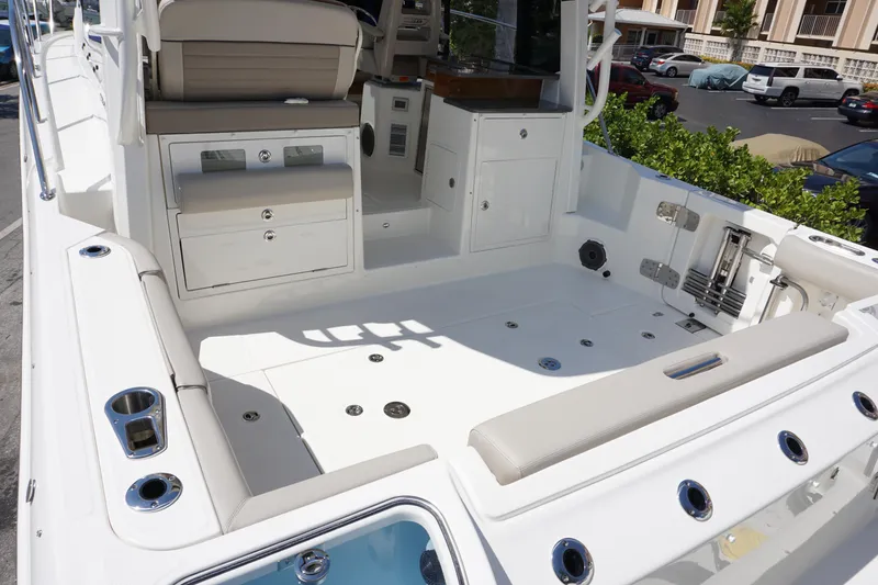 Slide: The Image of 2025 Boston Whaler 365 Conquest boat deck with seating and storage compartments. - 17