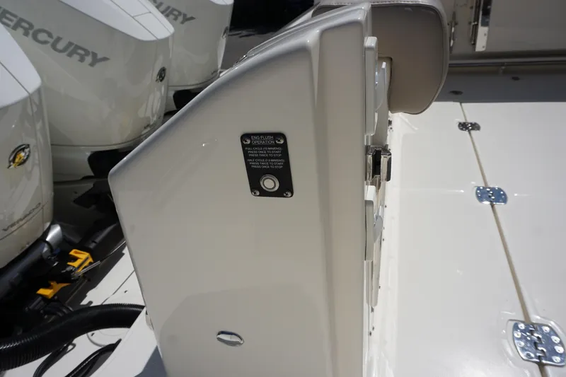 Slide: The Image of Boston Whaler 365 Conquest 2025 boat deck with Mercury engines in background. - 19