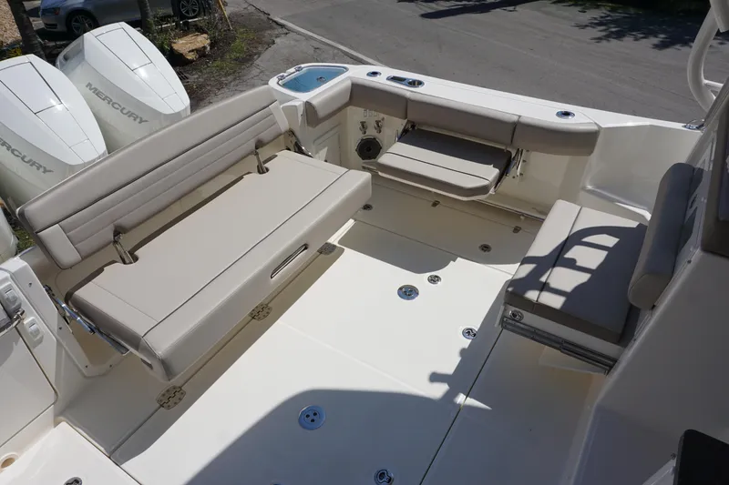 Slide: The Image of 2025 Boston Whaler 365 Conquest boat interior with seating and Mercury engines. - 22