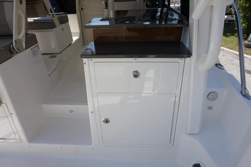 Slide: The Image of Interior view of 2025 Boston Whaler 365 Conquest, featuring sleek cabinetry and seating. - 28