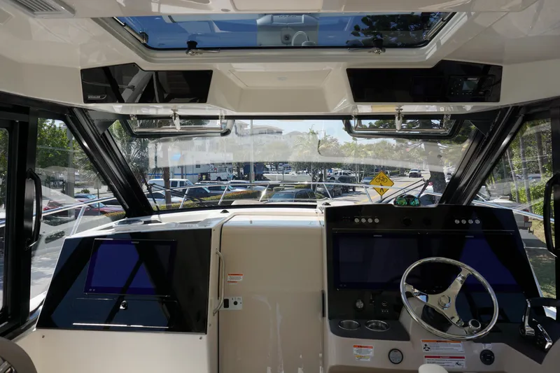 Slide: The Image of Interior cockpit of 2025 Boston Whaler 365 Conquest with modern navigation systems. - 47