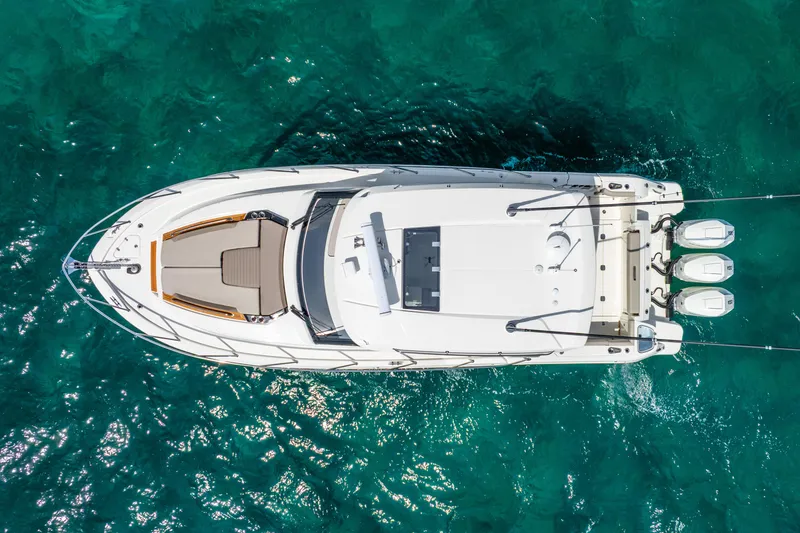 Slide: The Image of Aerial view of 2025 Boston Whaler 365 Conquest on clear turquoise water. - 5