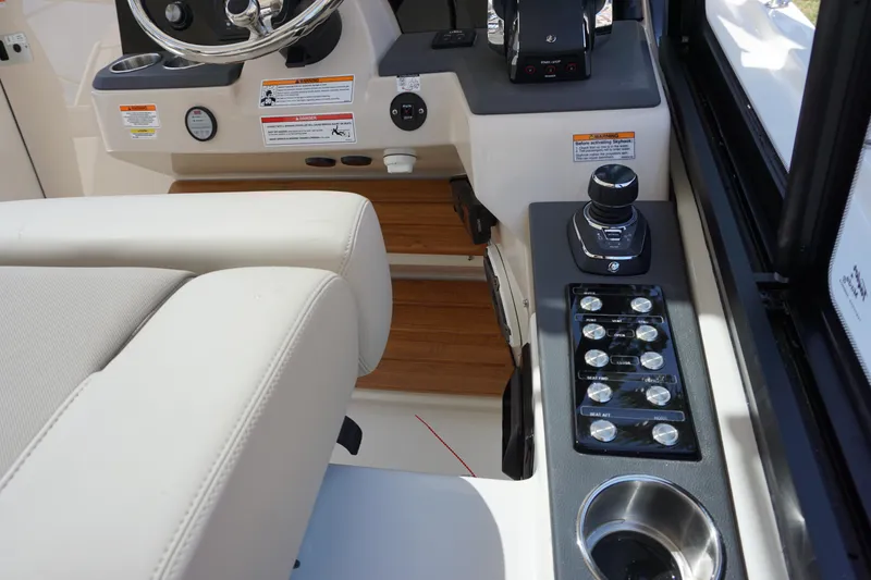 Slide: The Image of 2025 Boston Whaler 365 Conquest helm with controls and steering wheel. - 50
