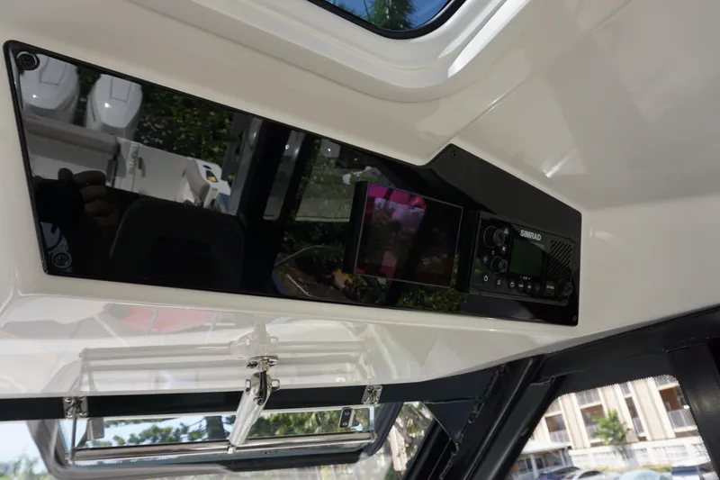 Slide: The Image of Interior dashboard of 2025 Boston Whaler 365 Conquest boat with navigation equipment. - 51