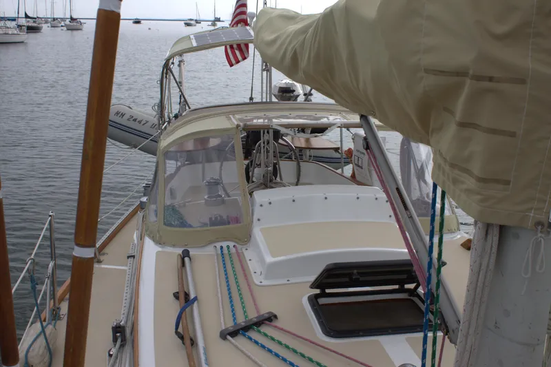 Slide: The Image of 1980 Bristol 35.5 sailboat docked, view of deck and cockpit area. - 11