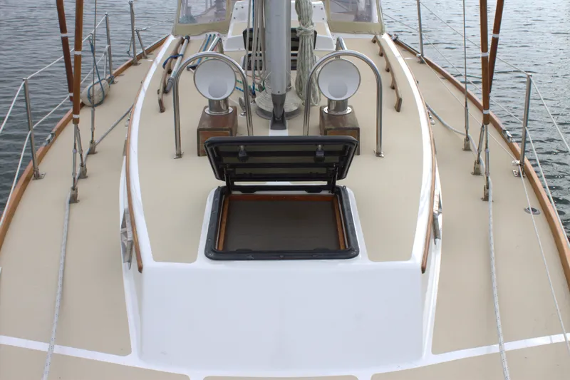 Slide: The Image of 1980 Bristol 35.5 sailboat deck with open hatch and winches. - 13