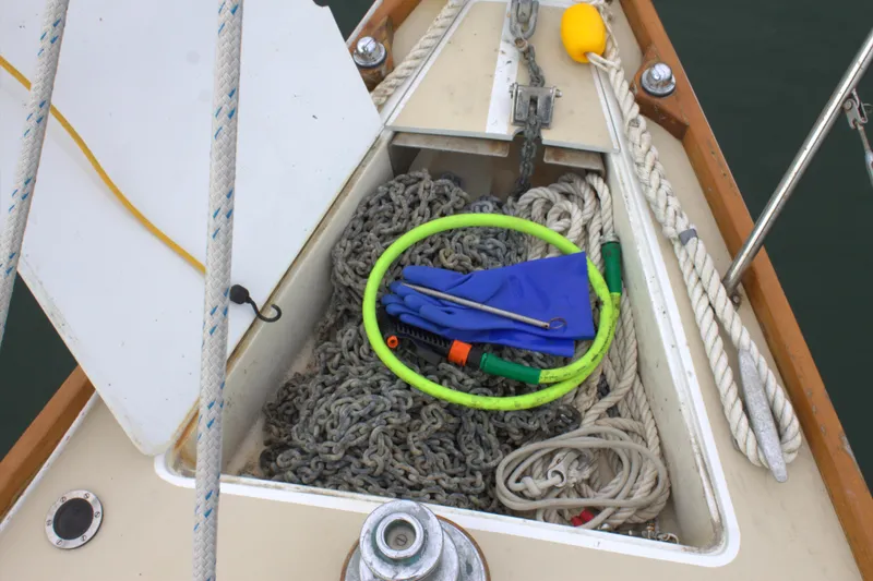 Slide: The Image of Anchor locker of a 1980 Bristol 35.5 sailboat with chains and ropes. - 15