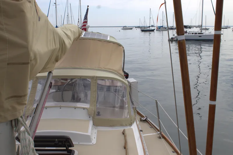 Slide: The Image of 1980 Bristol 35.5 sailboat docked in a marina with other boats. - 18