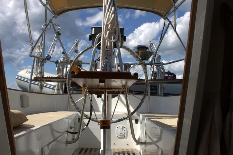 Slide: The Image of Cockpit of a 1980 Bristol 35.5 sailboat with steering wheel and rigging. - 21