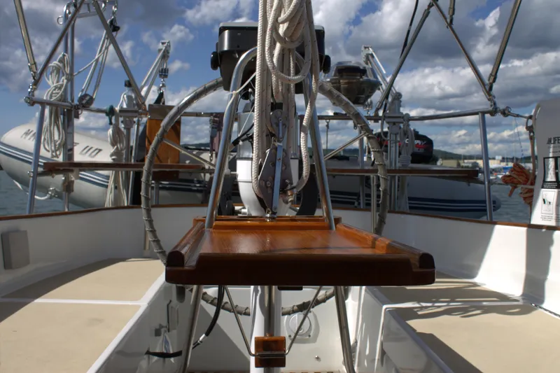 Slide: The Image of 1980 Bristol 35.5 sailboat cockpit with steering wheel and rigging. - 23