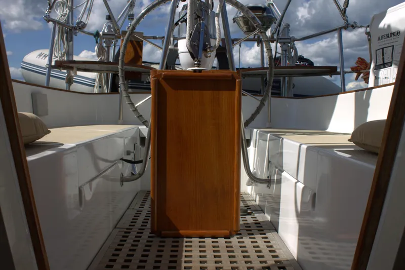 Slide: The Image of Cockpit of a 1980 Bristol 35.5 sailboat with wooden helm and seating. - 24