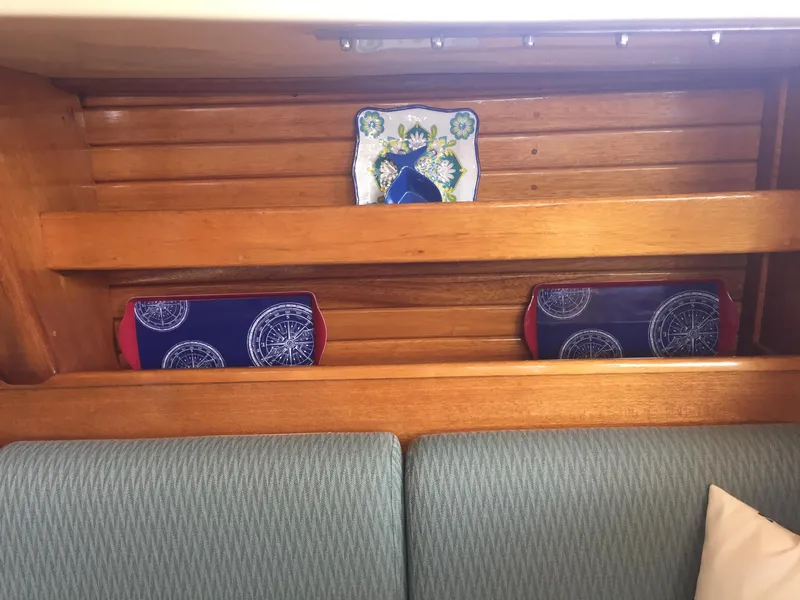 Slide: The Image of Interior of 1980 Bristol 35.5 sailboat with wooden shelves and nautical decor. - 33